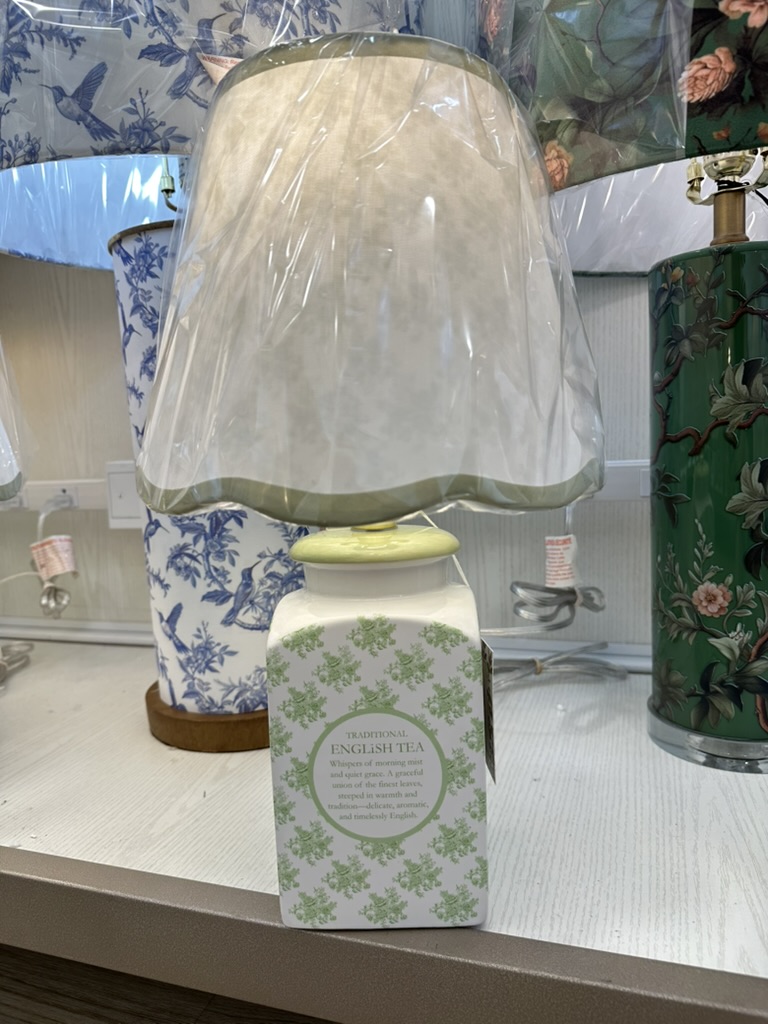 Green and white lamp that looks like a tea box.