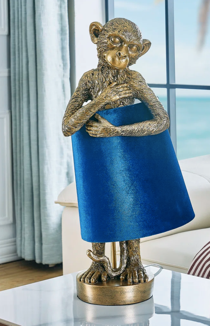 Novelty lamp of Monkey hugging a shade