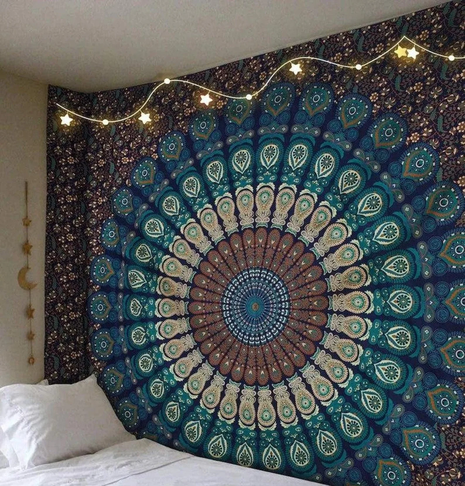 Tapestry hanging on wall next to bed