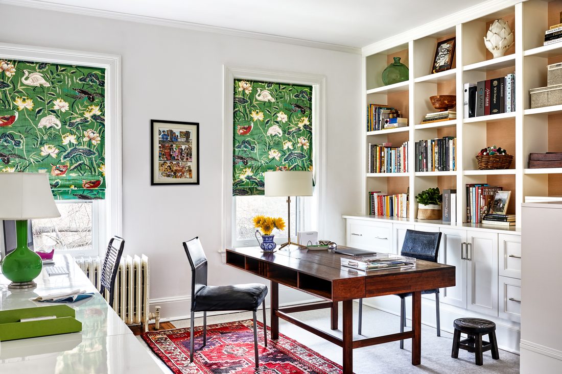 Sunny home office with built-in bookcases and midcentury desk