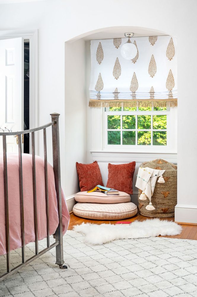 Bedroom with reading nook and floor pillows