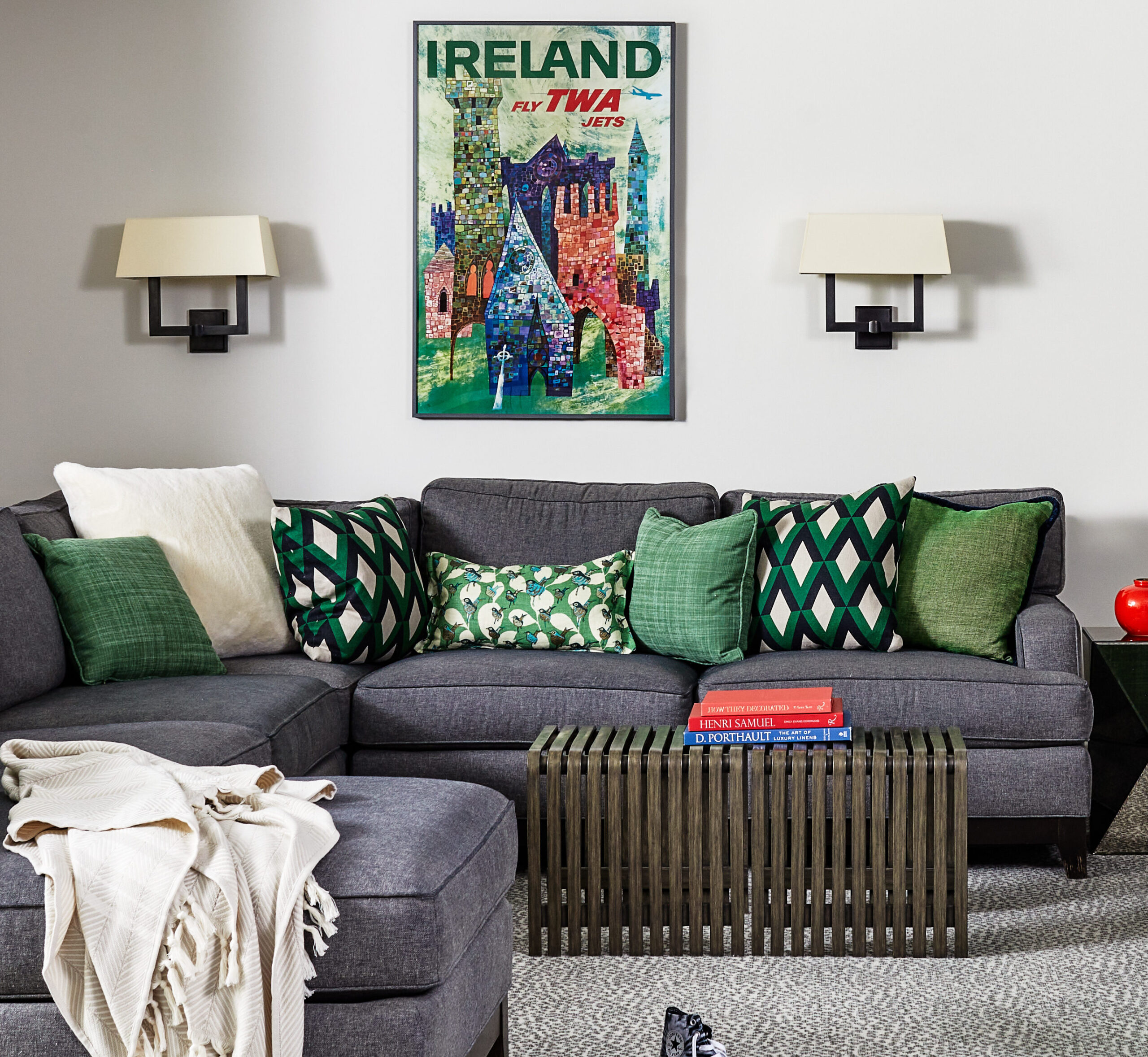 Gray sofa with various green pillows