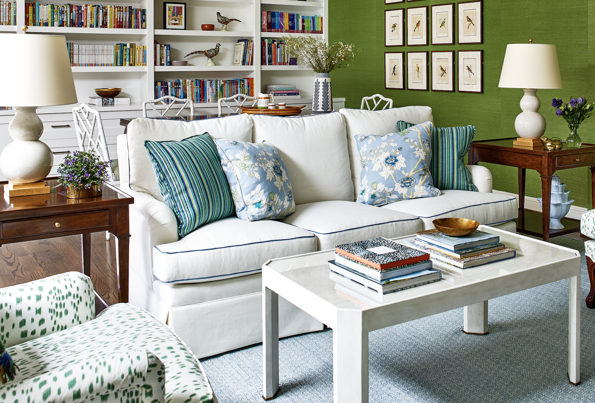 Sofa with various blue and green pillows