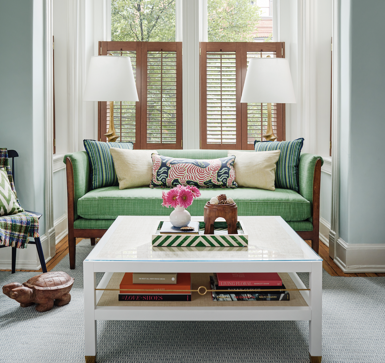 Green bench with lumbar pillows