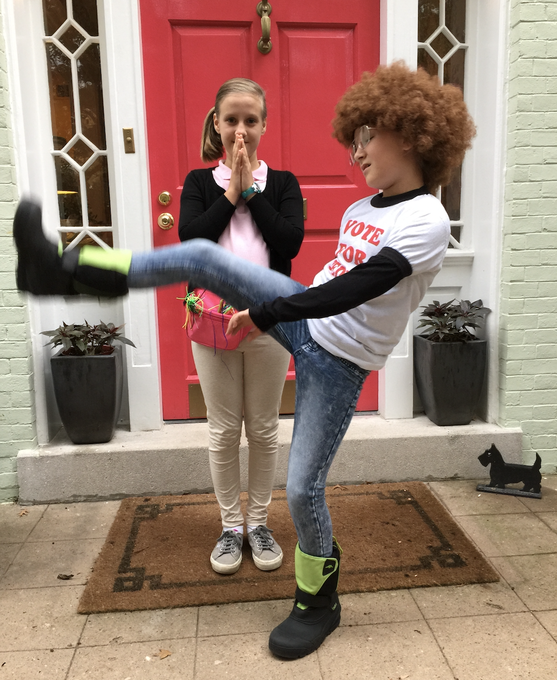 Two girls dressed in Napoleon Dynamite Halloween costumes.