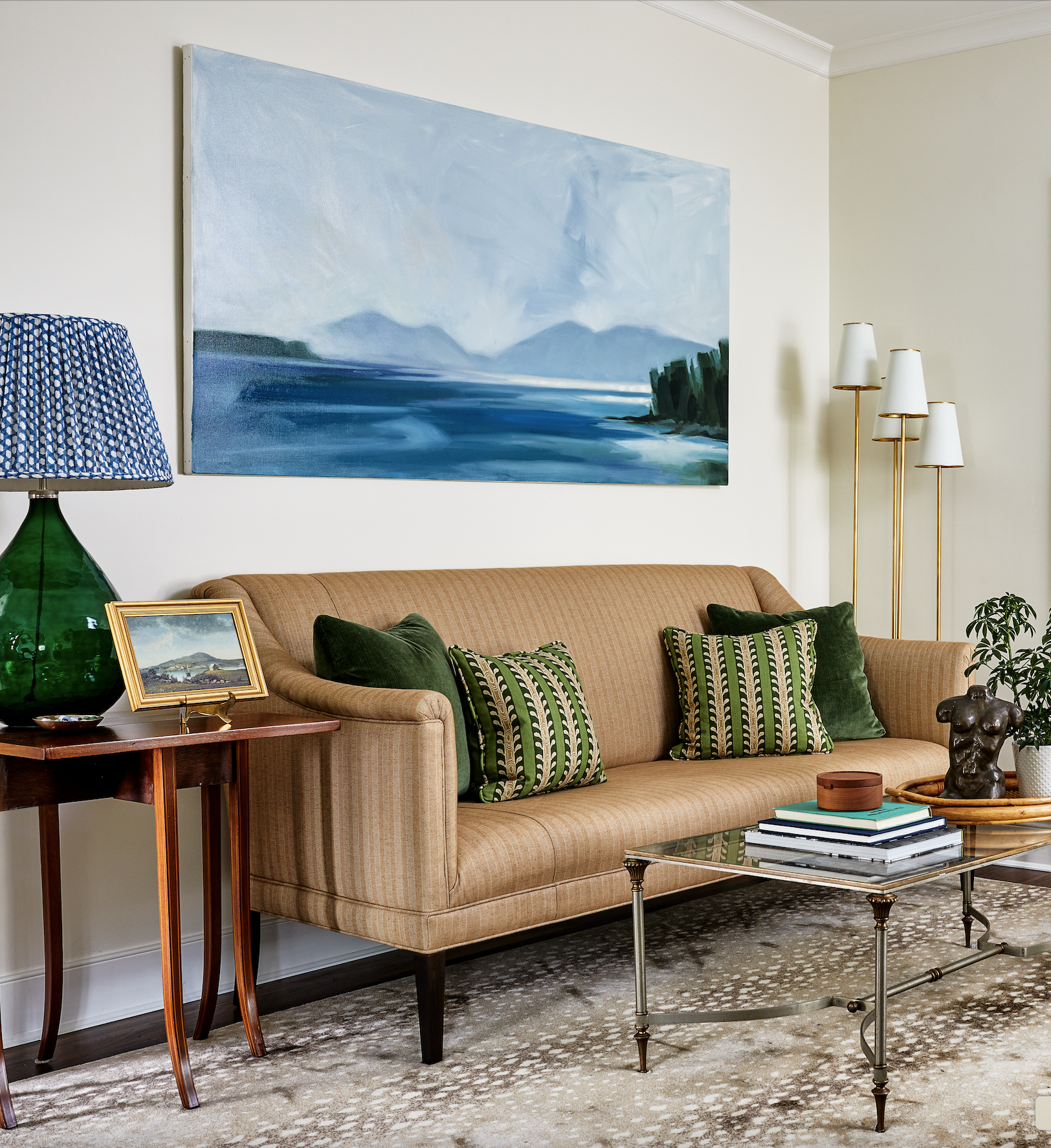 Green pillows on tan sofa